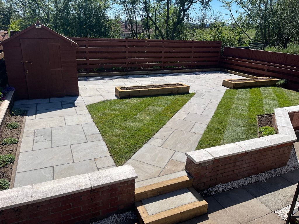 Finished garden patio and lawn transformation