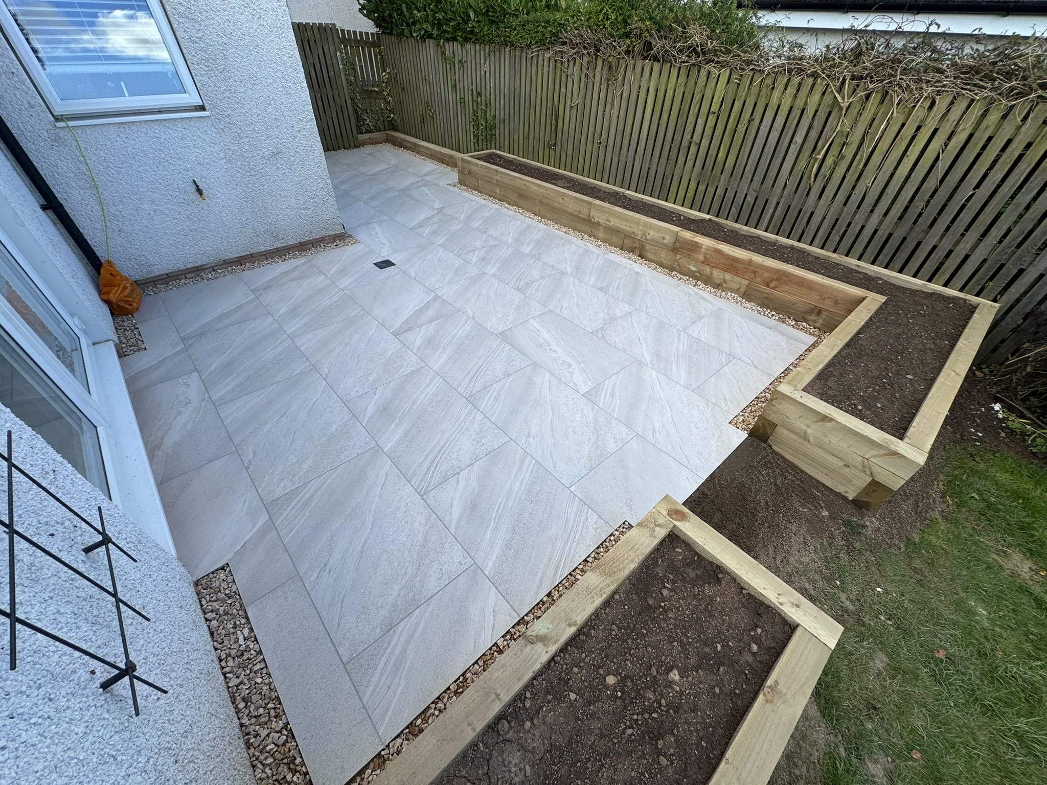 Sleeper planters and porcelain patio